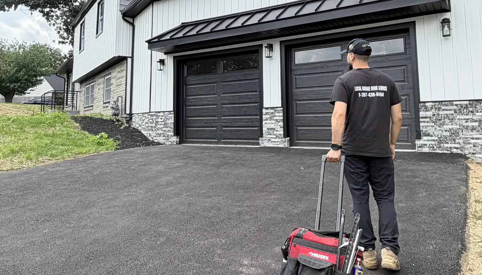 Local Garage Door Service technician arriving at a King of Prussia, Pennsylvania home with two garage doors