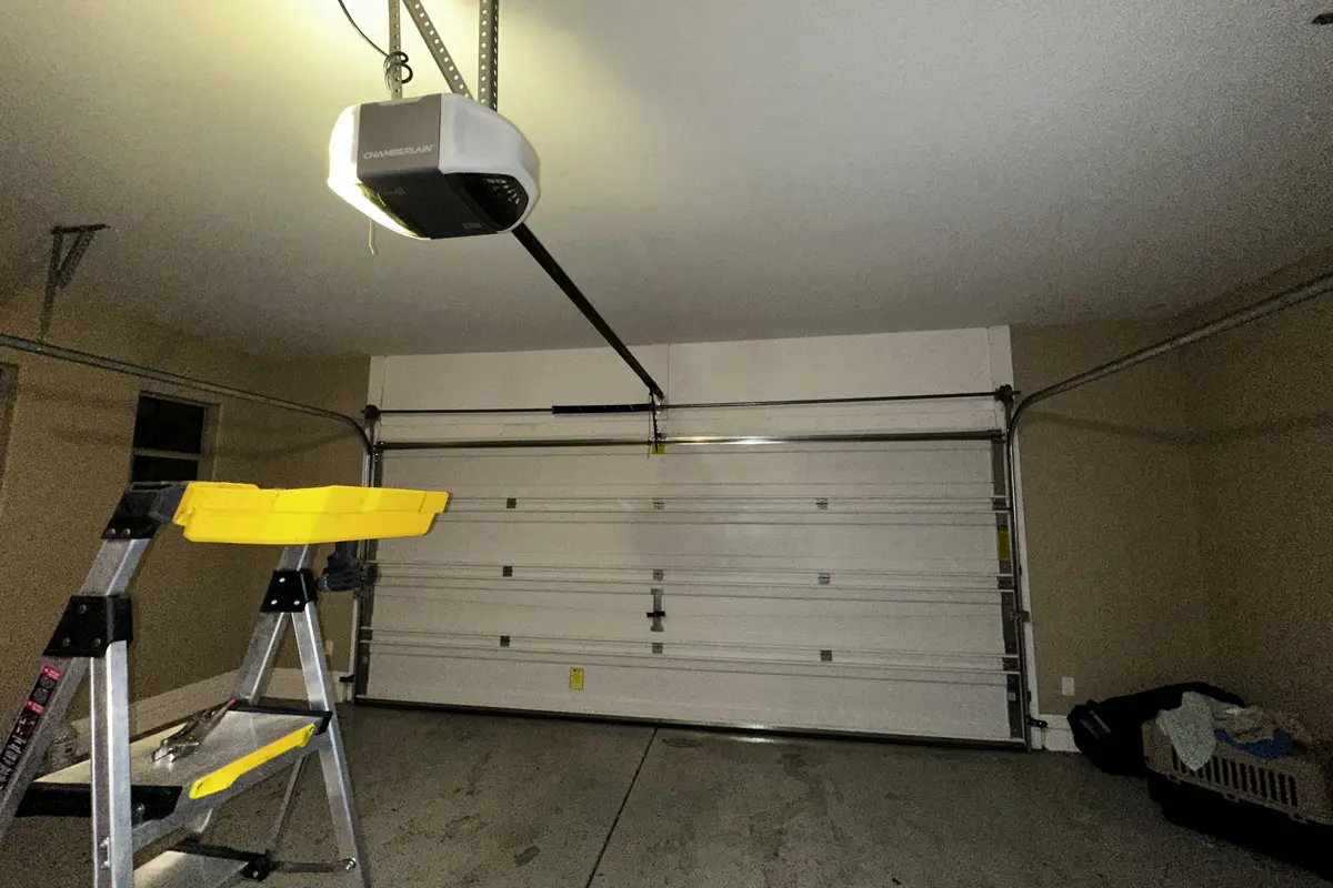 Garage door opener and rail inside a residential garage
