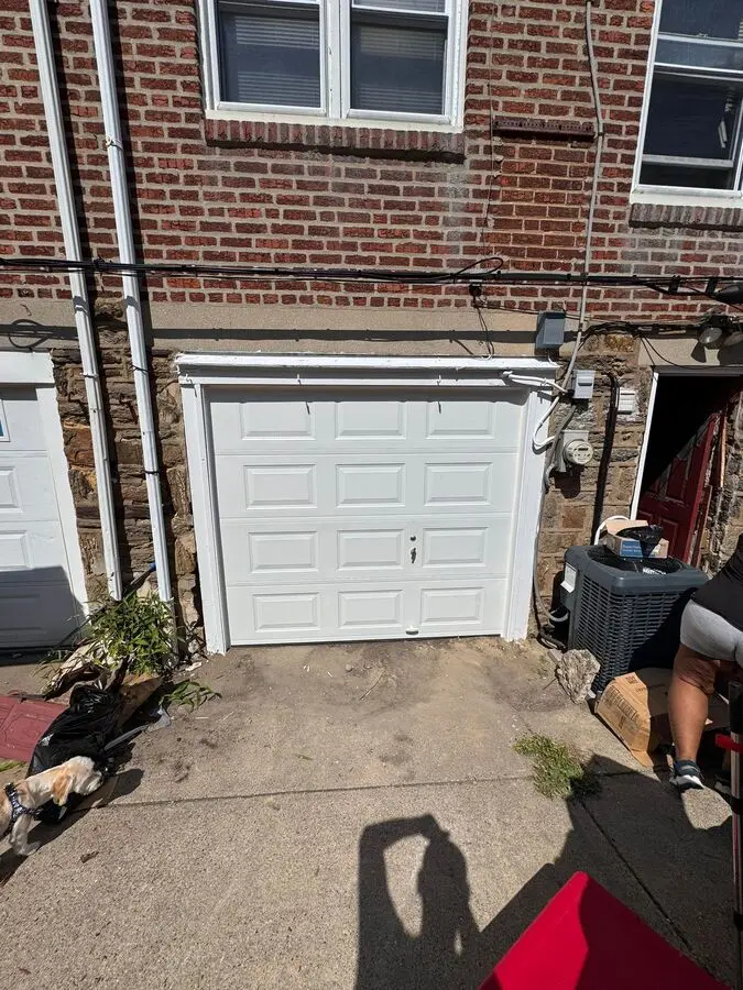 Completed white garage door after installation